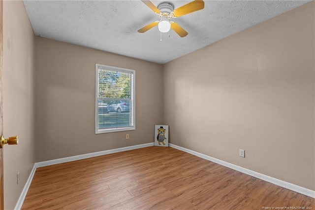 1018 Wood Creek Dr Unit 3, Fayetteville, NC 28314 - unfurnished room with wood finished floors, a textured ceiling, and a ceiling fan