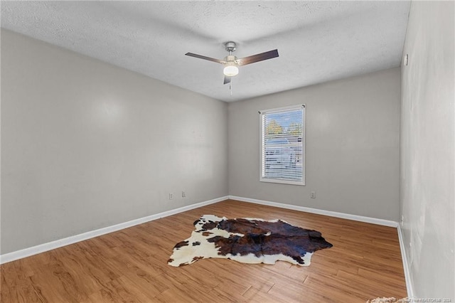 1018 Wood Creek Dr Unit 3, Fayetteville, NC 28314 - spare room with wood finished floors, ceiling fan, and a textured ceiling