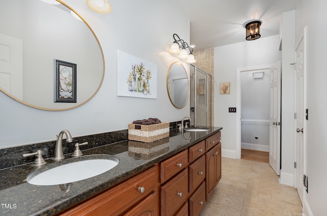 bathroom with vanity and an enclosed shower