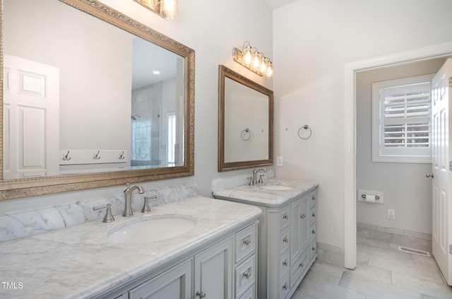 bathroom with tile patterned flooring and vanity