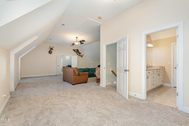 additional living space featuring light colored carpet and lofted ceiling