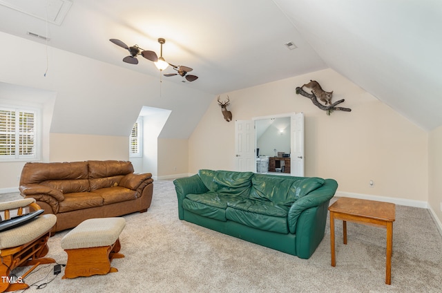 carpeted living room with lofted ceiling