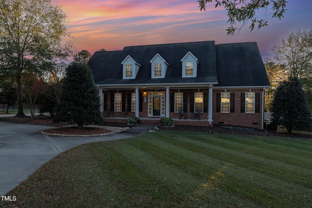 166 Weldon Dr, Clayton, NC 27520 - cape cod home with covered porch, brick siding, a lawn, and crawl space
