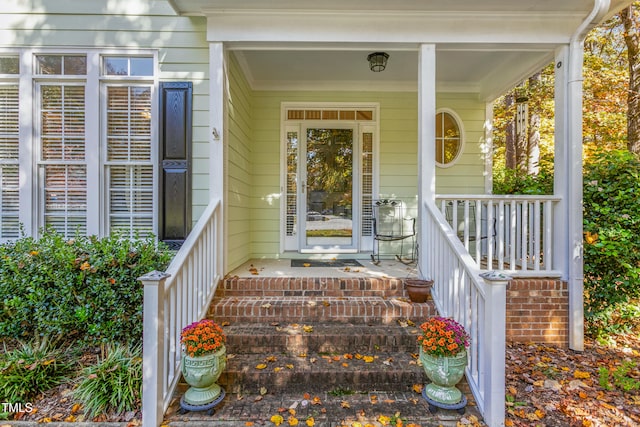 doorway to property featuring a porch