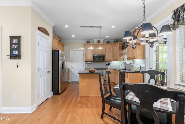 kitchen featuring light hardwood / wood-style flooring, hanging light fixtures, sink, black appliances, and crown molding