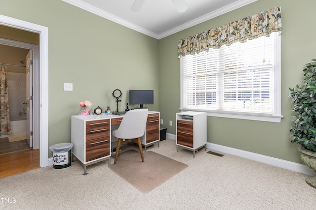 office space with crown molding, light colored carpet, and ceiling fan