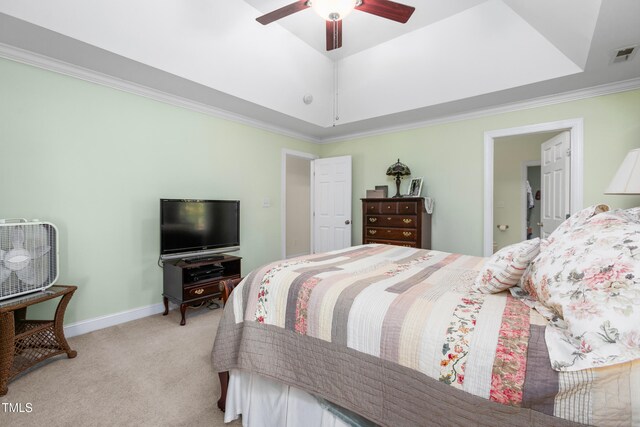 bedroom featuring ornamental molding, light colored carpet, and ceiling fan