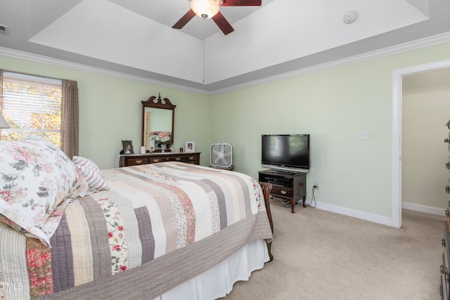 carpeted bedroom featuring ceiling fan, crown molding, and a raised ceiling