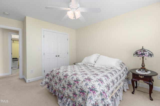 carpeted bedroom with a closet and ceiling fan