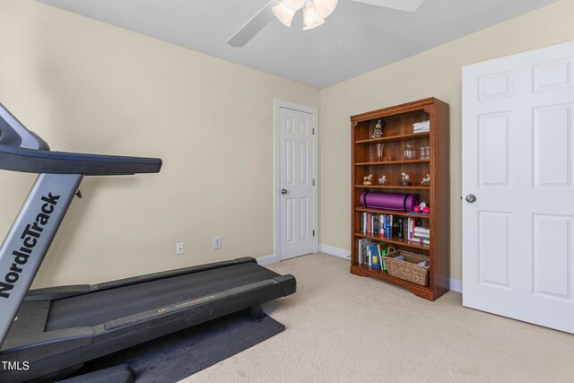 exercise area with light carpet and ceiling fan