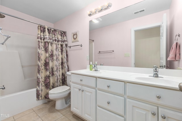 full bathroom with vanity, shower / bath combo, toilet, and tile patterned floors