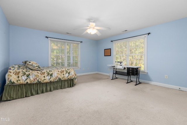 carpeted bedroom featuring ceiling fan