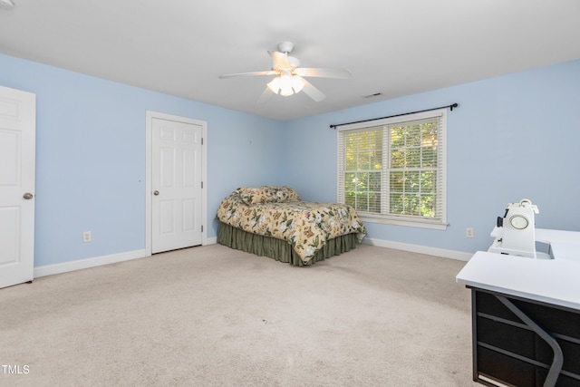 carpeted bedroom featuring ceiling fan