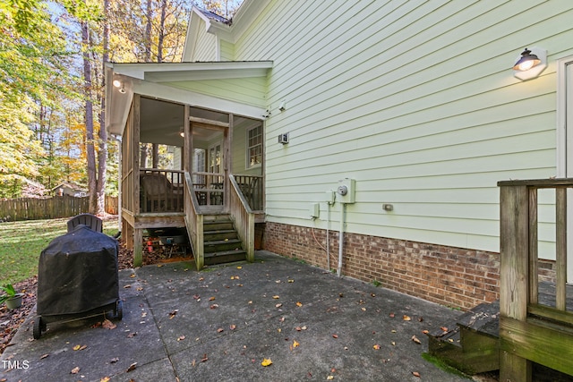 view of patio / terrace featuring a sunroom