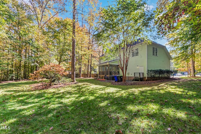 view of yard featuring a sunroom