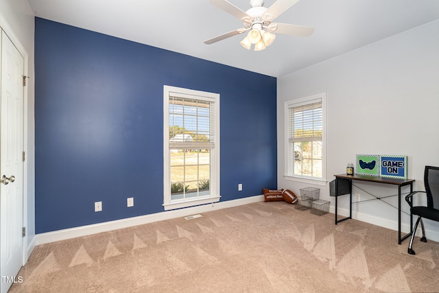 carpeted office with ceiling fan