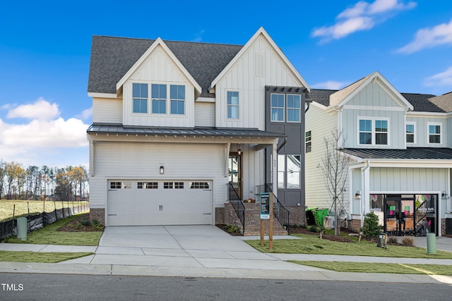 view of front of house featuring a front yard and a garage