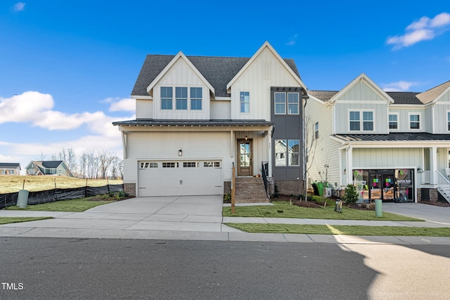 view of front of property featuring a front yard and a garage