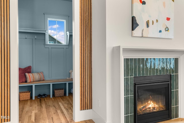 mudroom with wood-type flooring