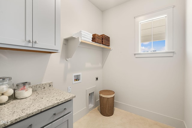 washroom featuring hookup for an electric dryer, washer hookup, and cabinets