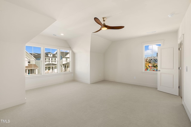 bonus room featuring ceiling fan, light colored carpet, and vaulted ceiling