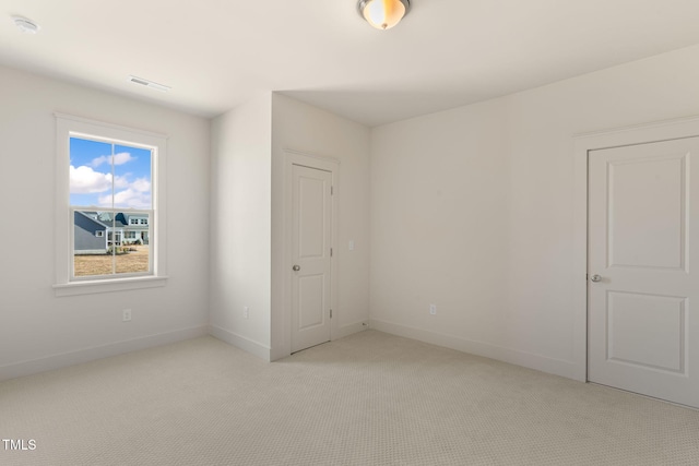 unfurnished bedroom with light carpet