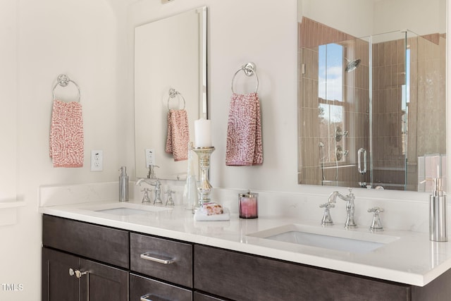 bathroom featuring vanity and an enclosed shower