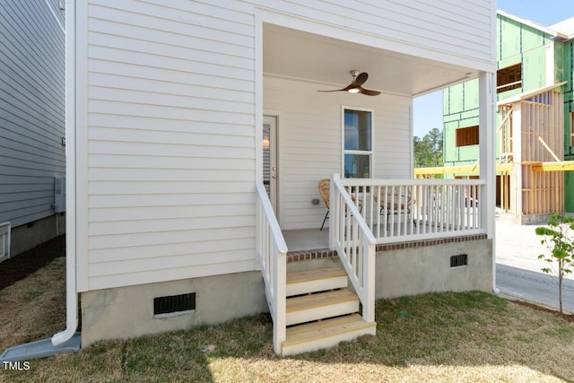 entrance to property with ceiling fan