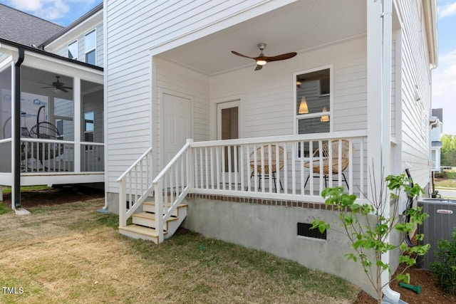 doorway to property with a yard, central air condition unit, and ceiling fan