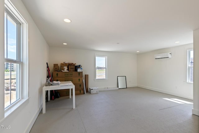 interior space featuring a wall unit AC and plenty of natural light