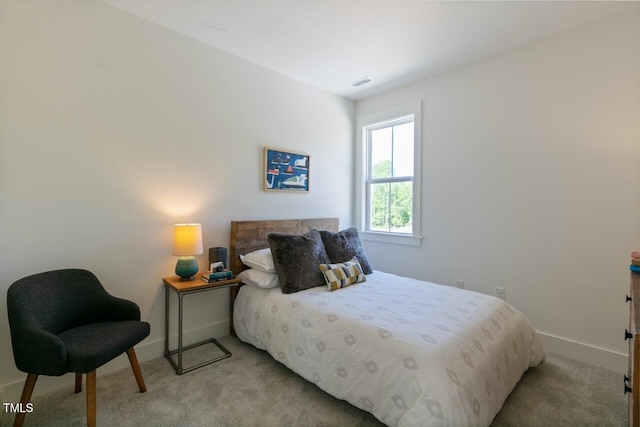 bedroom with light carpet