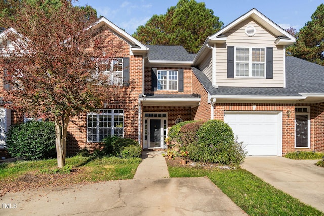 view of property featuring brick siding, roof with shingles, driveway, and a garage
