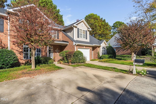 traditional home featuring brick siding, driveway, and an attached garage
