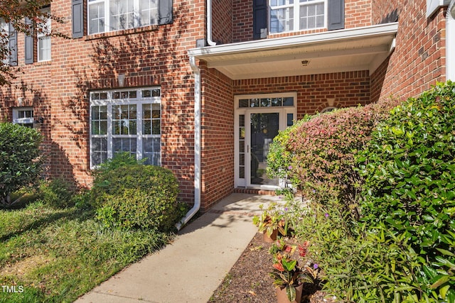 entrance to property with brick siding
