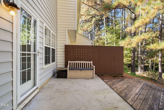 view of patio / terrace with a wooden deck and fence