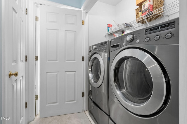 laundry area featuring washing machine and clothes dryer