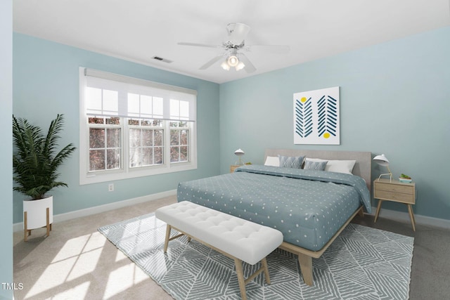 bedroom with carpet flooring, baseboards, and a ceiling fan