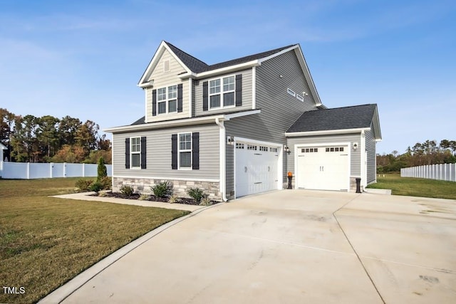 view of front of home featuring a garage and a front lawn