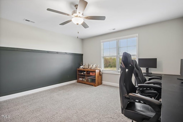 office space with light carpet and ceiling fan