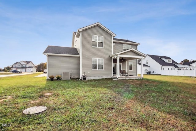 back of house with a yard, a patio, and central AC unit