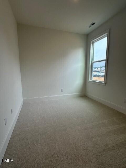 unfurnished room featuring carpet