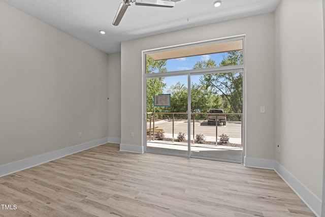 unfurnished room featuring light hardwood / wood-style floors and ceiling fan