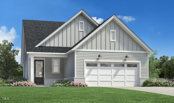 view of front facade with a front yard and a garage