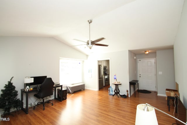 interior space with ceiling fan, lofted ceiling, and hardwood / wood-style floors