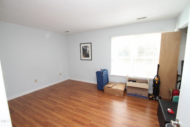 unfurnished room featuring hardwood / wood-style flooring