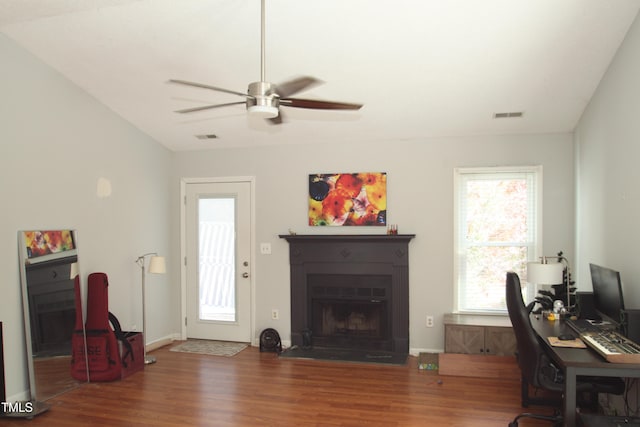 office area featuring vaulted ceiling, dark hardwood / wood-style flooring, and ceiling fan