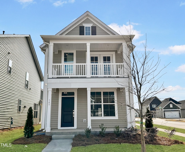 view of front of home featuring a balcony and covered porch