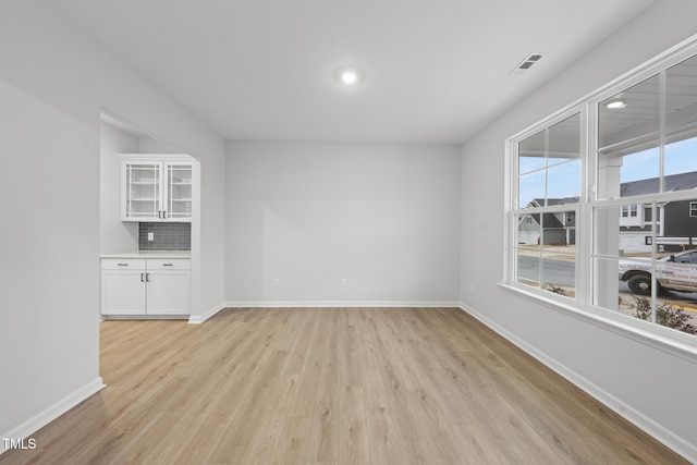 unfurnished room featuring light hardwood / wood-style floors