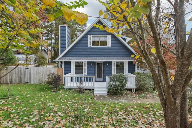 bungalow-style house with a front lawn