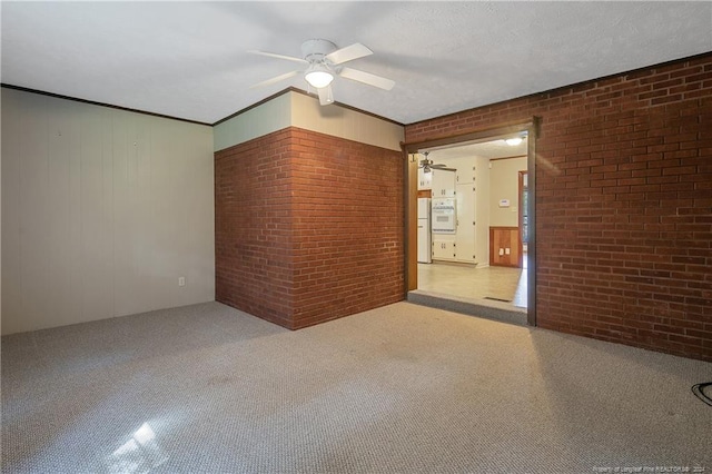 empty room with brick wall and ceiling fan